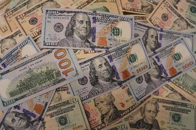 US dollar dips as risk off mood eases