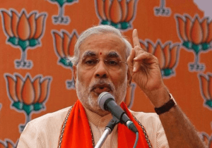 Modi votes, blasts UPA, sparks a storm