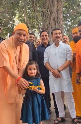 CM Yogi Adityanath Receives Toy Bulldozer from Young Admirer