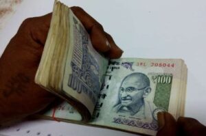 Rupee hits new record low of 76 82