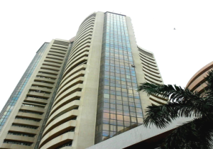 Sensex closes at record high; auto stocks gain